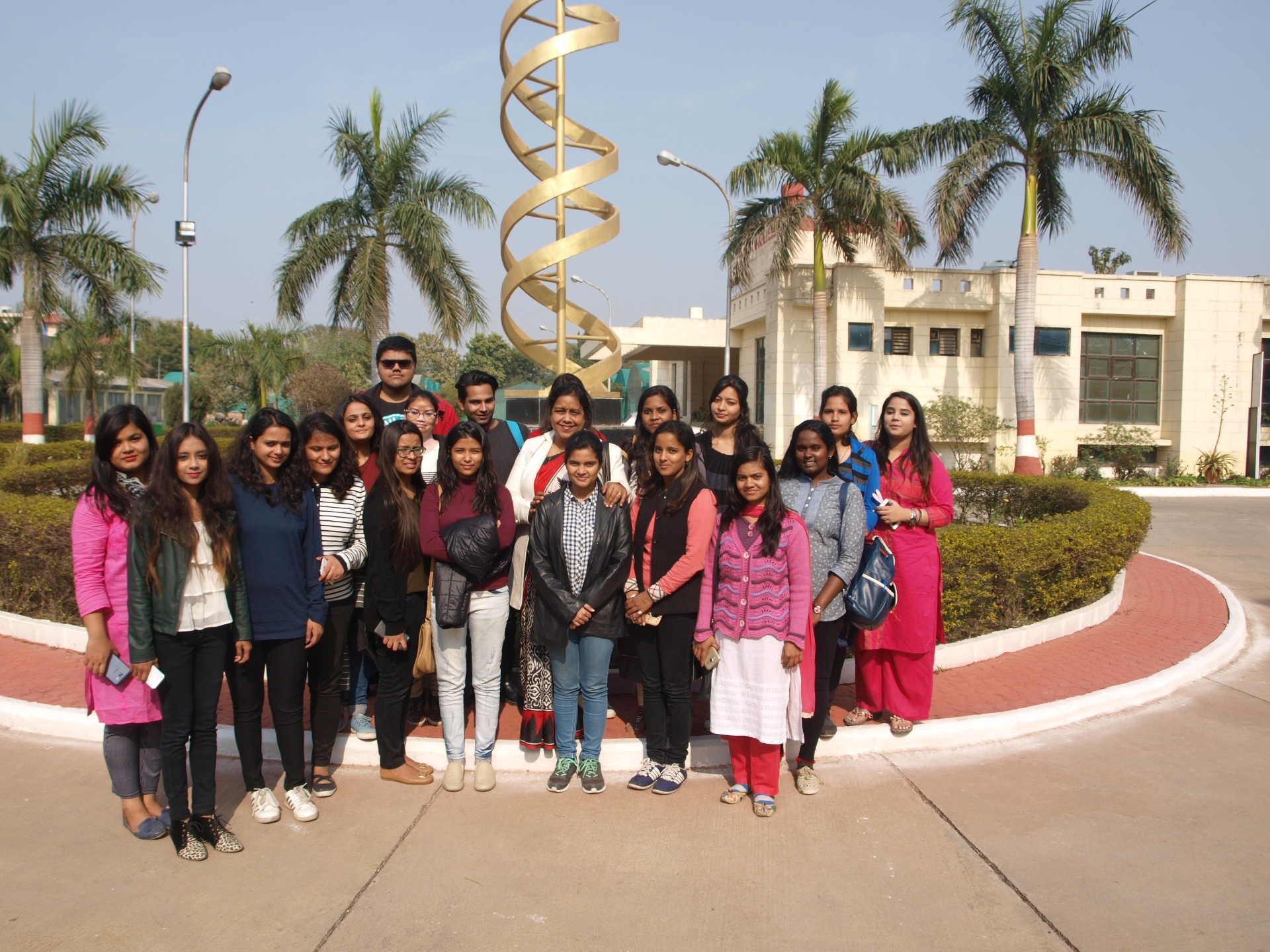 Amity University students group photo at Biotech Park DNA sculpture